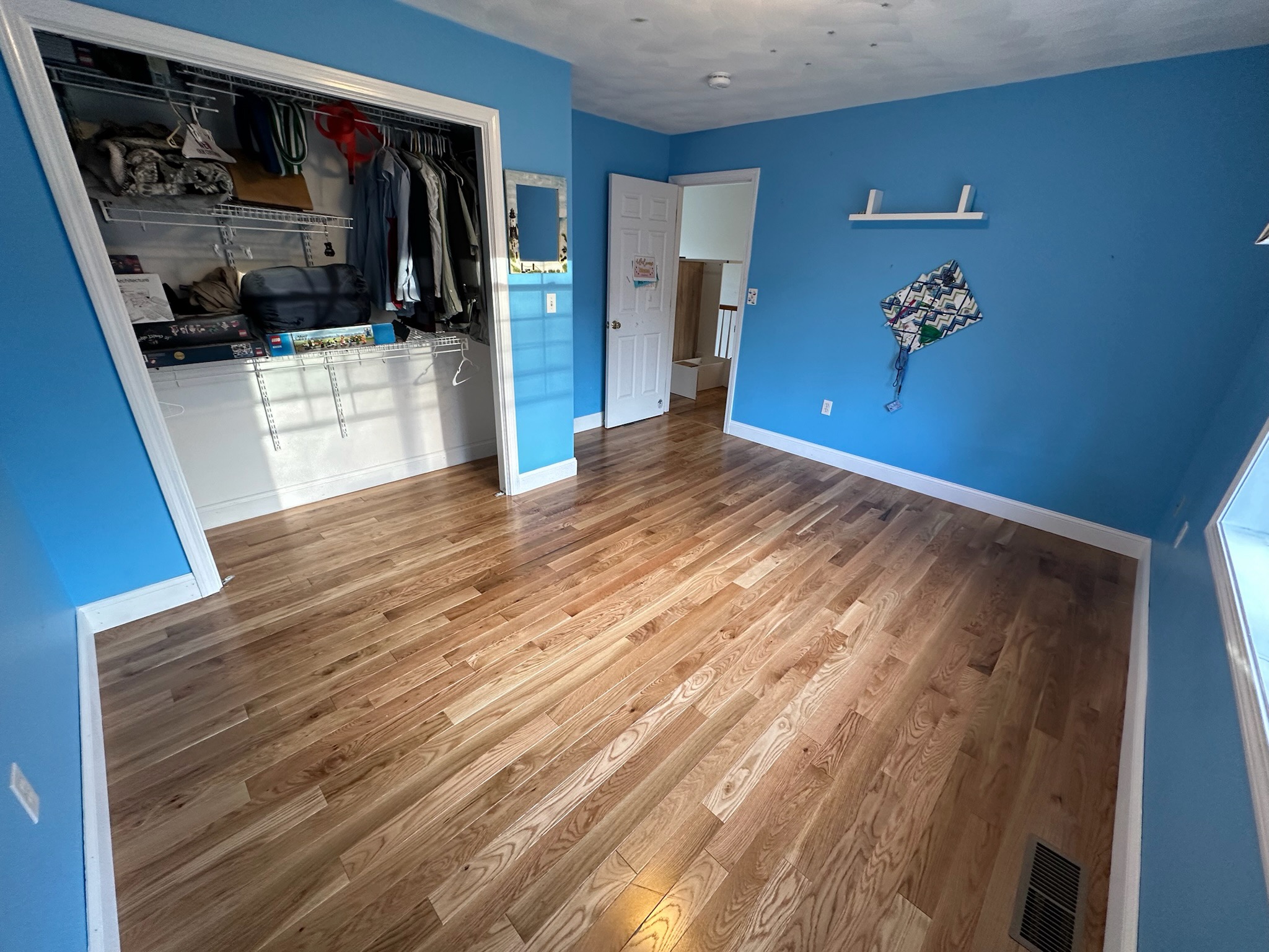 Hardwood floor installation by Upper Lower Renovations